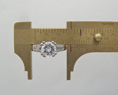 ELEGANT DIAMOND ACCENTED ENGAGEMENT RING SETTING FOR A ROUND CENTRAL STONE