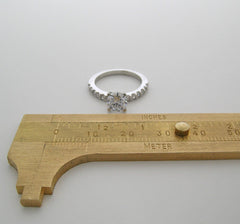 ENGAGEMENT RING SETTING WITH FEMININE DIAMOND ACCENTS