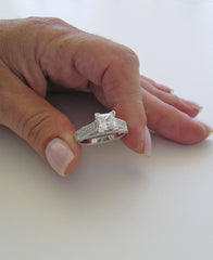 UNUSUAL RING SETTING FOR PRINCESS CUT ACCENTED WITH ROUND DIAMOND DETAILS