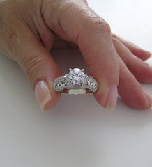 INTERESTING FEMININE DIAMOND ACCENTED RING SETTING