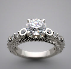 UNUSUAL ENGAGEMENT RING SETTING WITH FEMININE DIAMOND ACCENTS