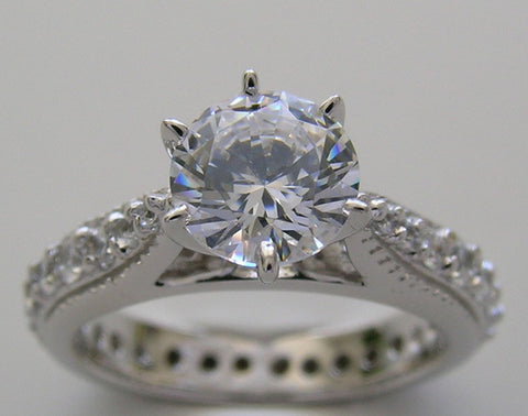 BEAUTIFUL TRADITIONAL ENGAGEMENT RING WITH DIAMOND STUDDED SHANK