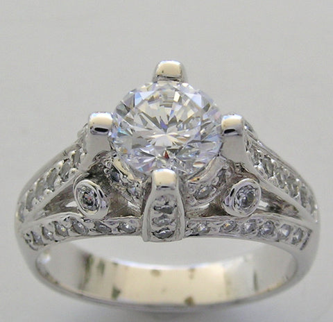 IMPORTANT ENGAGEMENT RING SETTING WITH ROUND DIAMOND ACCENTS 0.67 CT.