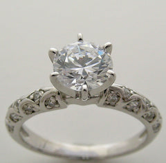 INTERESTING ENGAGEMENT RING SETTING FEMININE DIAMOND DETAILS