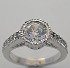 FEMININE ROUND DIAMOND ENGAGEMENT RING SETTING