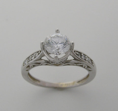 ENGAGEMENT RING SETTING WITH FEMININE DIAMOND DETAILS