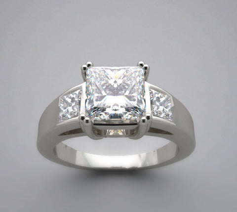 IMPORTANT THREE STONE PRINCESS CUT RING SETTING