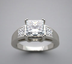 IMPORTANT THREE STONE PRINCESS CUT RING SETTING