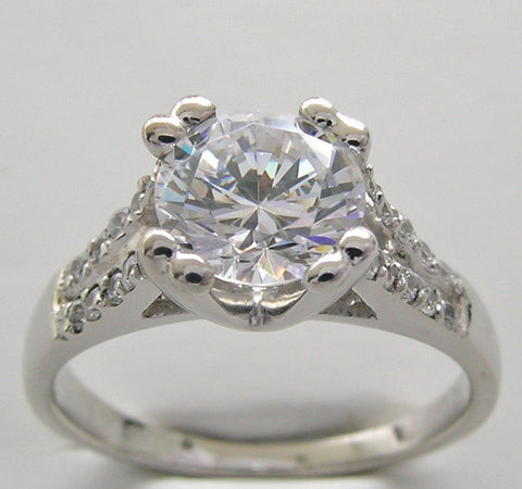 ELEGANT DIAMOND ACCENTED ENGAGEMENT RING SETTING FOR A ROUND CENTRAL STONE