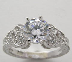 DIAMOND RING SETTING WITH FEMININE FLORAL ACCENTS AND MIL GRAIN DESIGN