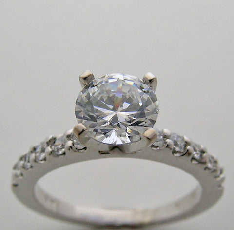 ENGAGEMENT RING SETTING WITH FEMININE DIAMOND ACCENTS