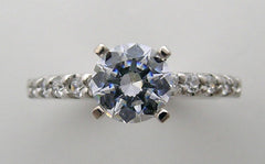 ENGAGEMENT RING SETTING WITH FEMININE DIAMOND ACCENTS