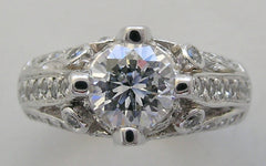 IMPORTANT ENGAGEMENT RING SETTING WITH ROUND DIAMOND ACCENTS 0.67 CT.