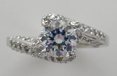 GRACEFUL UNUSUAL ENTWINNED SWIRL DESIGN SOLITAIRE RTING SETTING WITH DIAMOND ACCENTS