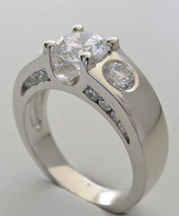 UNUSUAL THREE STONE RING SETTING DESIGN WITH DIAMOND SIDE ACCENTS