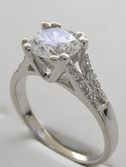 ELEGANT DIAMOND ACCENTED ENGAGEMENT RING SETTING FOR A ROUND CENTRAL STONE