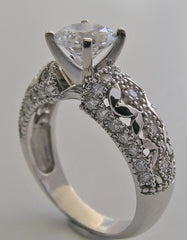 INTERESTING FEMININE DIAMOND ACCENTED RING SETTING