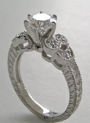 DIAMOND RING SETTING WITH FEMININE FLORAL ACCENTS AND MIL GRAIN DESIGN