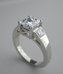 IMPORTANT THREE STONE PRINCESS CUT RING SETTING