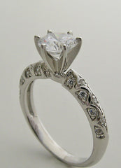 INTERESTING ENGAGEMENT RING SETTING FEMININE DIAMOND DETAILS