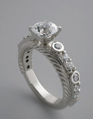 UNUSUAL ENGAGEMENT RING SETTING WITH FEMININE DIAMOND ACCENTS