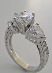 UNUSUAL ROUND AND HEART SHAPE DIAMOND ENGAGEMENT RING SETTING