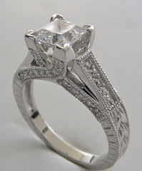 UNUSUAL RING SETTING FOR PRINCESS CUT ACCENTED WITH ROUND DIAMOND DETAILS