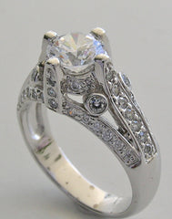 IMPORTANT ENGAGEMENT RING SETTING WITH ROUND DIAMOND ACCENTS 0.67 CT.