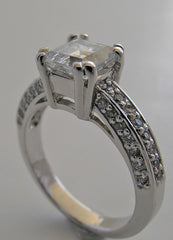 FEMININE RING SETTING FOR PRINCESS SHAPE STONE SET WITH ROUND DIAMONDS