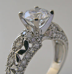 INTERESTING FEMININE DIAMOND ACCENTED RING SETTING