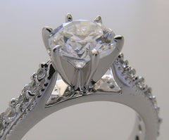 BEAUTIFUL TRADITIONAL ENGAGEMENT RING WITH DIAMOND STUDDED SHANK