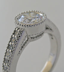 FEMININE ROUND DIAMOND ENGAGEMENT RING SETTING