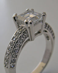 FEMININE RING SETTING FOR PRINCESS SHAPE STONE SET WITH ROUND DIAMONDS