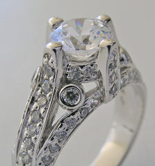 IMPORTANT ENGAGEMENT RING SETTING WITH ROUND DIAMOND ACCENTS 0.67 CT.