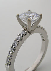 ENGAGEMENT RING SETTING WITH FEMININE DIAMOND ACCENTS