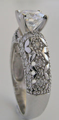 INTERESTING FEMININE DIAMOND ACCENTED RING SETTING