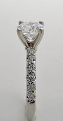 ENGAGEMENT RING SETTING WITH FEMININE DIAMOND ACCENTS