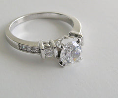 FEMININE THREE STONE RING SETTING WITH DIAMOND ACCENT DESIGN