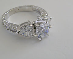 UNUSUAL ROUND AND HEART SHAPE DIAMOND ENGAGEMENT RING SETTING