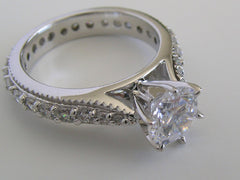 BEAUTIFUL TRADITIONAL ENGAGEMENT RING WITH DIAMOND STUDDED SHANK