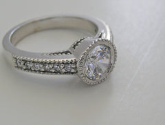 FEMININE ROUND DIAMOND ENGAGEMENT RING SETTING