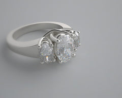 UNUSUAL OVAL THREE STONE DIAMOND RING SETTING