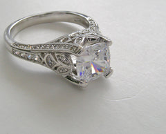 IMPORTANT FLORAL DIAMOND DETAIL PRINCESS SHAPE RING SETTING