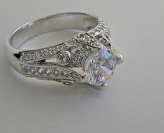 IMPORTANT ENGAGEMENT RING SETTING WITH ROUND DIAMOND ACCENTS 0.67 CT.