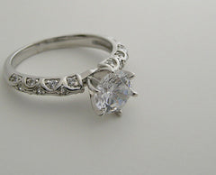 INTERESTING ENGAGEMENT RING SETTING FEMININE DIAMOND DETAILS