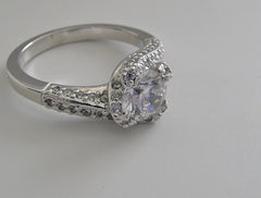 GRACEFUL UNUSUAL ENTWINNED SWIRL DESIGN SOLITAIRE RTING SETTING WITH DIAMOND ACCENTS