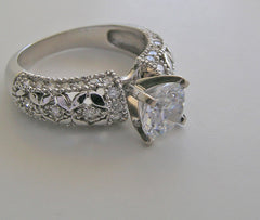 INTERESTING FEMININE DIAMOND ACCENTED RING SETTING