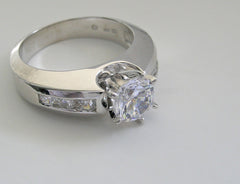 TRADITIONAL ENGAGEMENT RING SETTING WITH CHANNEL SET DIAMOND ACCENT