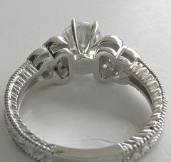 DIAMOND RING SETTING WITH FEMININE FLORAL ACCENTS AND MIL GRAIN DESIGN