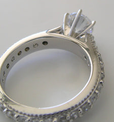 BEAUTIFUL TRADITIONAL ENGAGEMENT RING WITH DIAMOND STUDDED SHANK